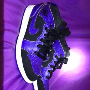 Purple, black and white Nike Air Jordan 1’s.